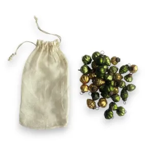 GREEN AND GOLD ORANEMNTS IN MUSLIN BAG